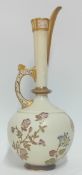 A Royal Worcester jug, with pierced foliate design to rim and handle, gilt detailing to floral