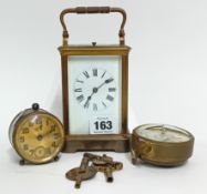 An early 20th century French carriage clock, with roman enamel dial, height 17cm, together with a