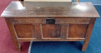 A Jacobean oak chest, carved border pattern, on straight feet,