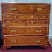 A modern yew and brass mounted campaign chest of drawers, with decorative veneered
