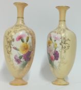 A pair of Royal Worcester blush coloured vases, pattern no. 790, painted flowers over a blush