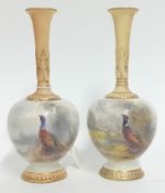 An early 20th century pair of Royal Worcester miniature vases, with gilt detailing and painted