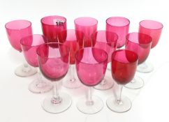 A collection of coloured wine glasses and tumblers, comprising 21 tumblers and 12 wineglasses in