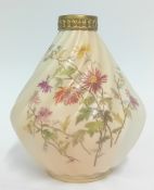 A late 19th century Royal Worcester twist fluted vase, with gilt detailing and floral imagery on a