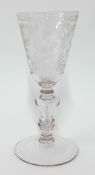 A 19th century cut wine glass, with engraved foliate design and cut glass knop, height 19cm.