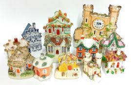 A collection of porcelain pastille burners in the form of houses, together with a spill vase in