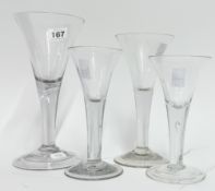 Four 18th century trumpet wine glasses, comprising two with folded rims and stem air bubble, max