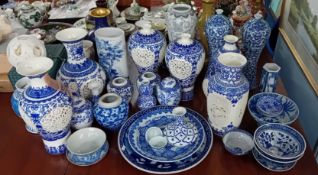 A quantity of Chinese reproduction blue and white porcelain, to include vases, bowls, plates etc.