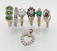 Six gold rings set with stones, together with a 9ct heart pendant, overall weight 12.8g.