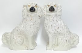 A large pair of Staffordshire dogs, white with gilt details, height 40cm. (2)