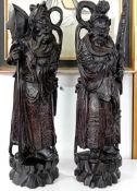 A pair of Oriental carved wooden figures, height approx 42cm.