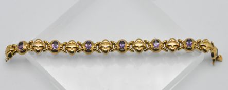A 9ct gold link bracelet set with amethysts, overall weight 13,6g.