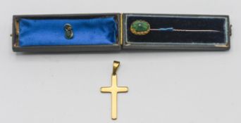 A late 19th century yellow metal tie pin, with head in the form of a green beetle, length 7cm, in