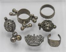 White metal Arabic ? charms and rings, with crown brooch (6).