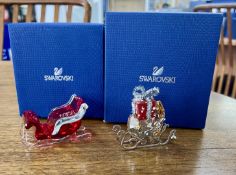Swarovski Crystal Glass, two pieces including 'Winter Sleigh' and 'Santa's Sleigh - 2016', all boxed