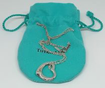 A Tiffany & Co. silver heart pendant on a chain, weight 7.2g.