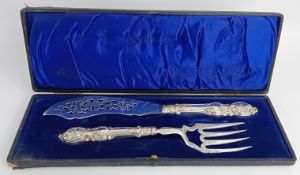 A Victorian silver fish slice and fork, cased, of foliate embossed, engraved and pierced decoration,