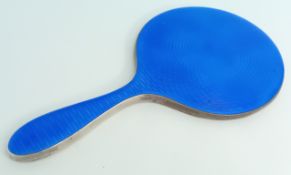 A silver and blue enamel hand mirror, hallmarked Birmingham 1923. maker probably Turner and