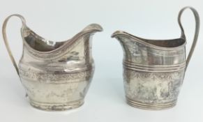 Two George III early 19th century silver jugs, with wreath and foliate engraving, one hallmarked