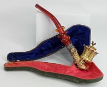 A Victorian gilt metal foliate design pipe, with stopper, with red coloured glass stem, in fitted