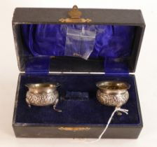 Pair of cased hallmarked Chester silver salts, one foot broken off but present. Weight 25.3g