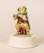 A Miniature Porcelain Model of a Frog Flautist, signed S. Baffley to base. Height: 6cm