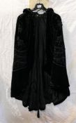 Black velvet evening cape, embellished with glass beads. Comes with a letter from Antiques