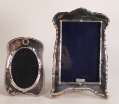 Silver Art Noveau photo frame, 21 x 13cm and a similar smaller example. (2)