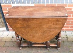 Fine quality reproduction oak gateleg dining table, associated with the last lot. Measures 90cm long
