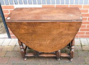 Fine quality reproduction oak gateleg dining table, associated with the last lot. Measures 90cm long