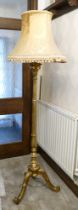 Gilt wood tripod full height floor standing standard lamp, 143cm high to base of candle.