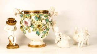 An Unmarked English Porcelain Vase flanked by two Putti and naturalistic flowers, Greek Key
