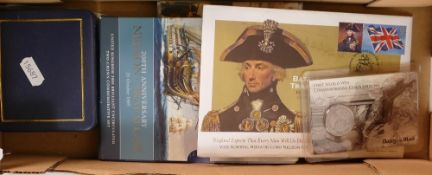 A collection of commemorative coins including Battle of Trafalgar, D-Day, Royal Navy, all in