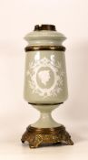 Late 19th Century Pate-sur-pate Oil Lamp Base on Celadon Ground. Base of reservoir inscribed CB.