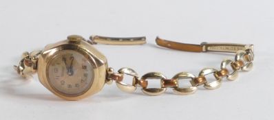 9ct gold hallmarked Rotary ladies wrist watch, 22mm high, on a gold plated bracelet.