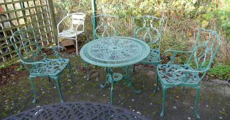 Green metal circular table pation set with four chairs