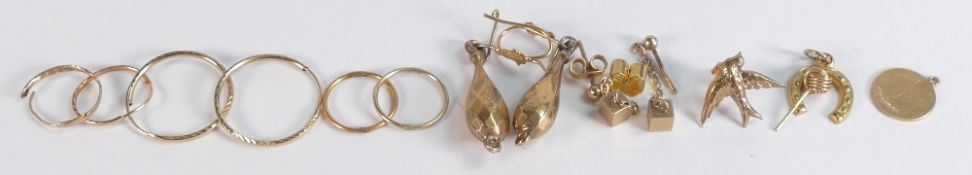 A collection of 9ct gold items including earrings, pendants etc, 6.4g.