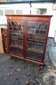 Mahogany inlaid and cross banded display cabinet with ball and claw feet. 125w x 37cm d x 146 high