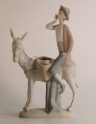 Lladro young man on donkey figure, stands 28cm high. Small hairline to base, appears possibly