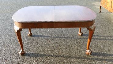 Extending Mahogany dining table with claw and ball feet. 162cm x 53cm. Extension measures 53cm wide