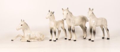 Four Beswick Foals to include small white 1084, small white shire 1053, large white thoroughbred