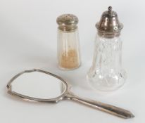 Hallmarked silver backed Art Deco mirror, and two silver topped sugar shakers with cut glass