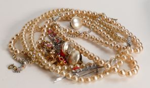 A collection of ladies vintage costume jewellery including beads, earrings etc.