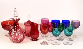A Collection of Cranberry & Colour Glass items to include Carafe , Wine Glasses, Jug, lidded pot etc
