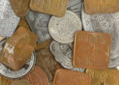 A collection of post-war fantasy metal war tokens, including German occupation tags Jersey,