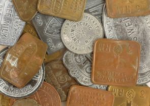 A collection of post-war fantasy metal war tokens, including German occupation tags Jersey,