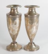 Two large silver vases in poor condition, loading missing from base of one, with dents and