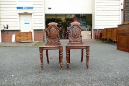 A Pair of Late 18th / Early 19th Century Hall Chairs with Rocaille Motif to front cartouche. Height: