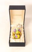 Moorcroft enamel Easter egg decorated with purple irises . Boxed with stand. Height 6cm