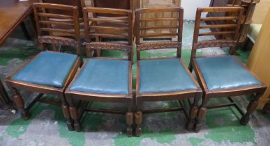 Set of 4 Oak dining chairs with turned front supports and green vinyl seat covers
